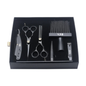 Set of black hairdressing tools including scissors, comb, and other accessories in a black box on a white background.