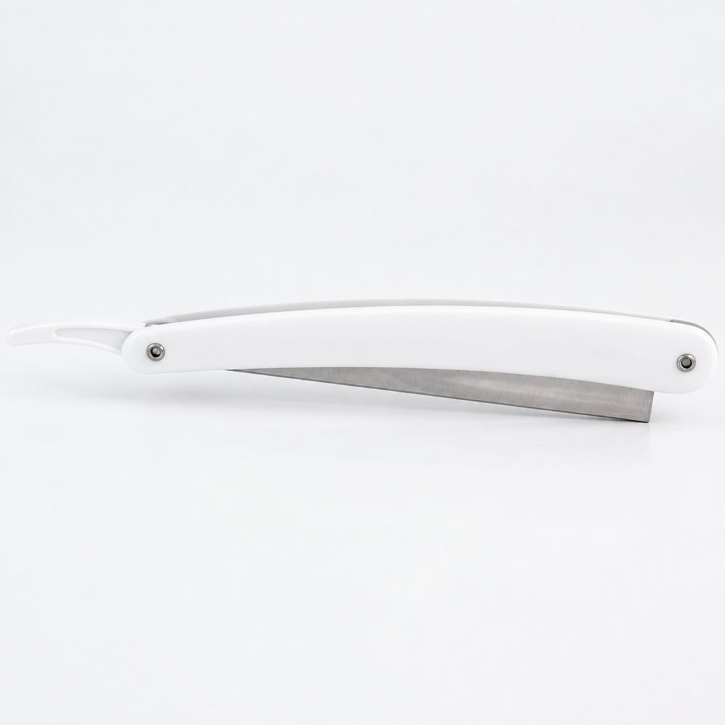 white plastic handle shaving razor with metal blade holder on a white background. Razor shown in closed position