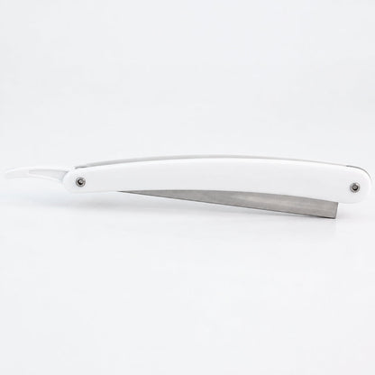white plastic handle shaving razor with metal blade holder on a white background. Razor shown in closed position