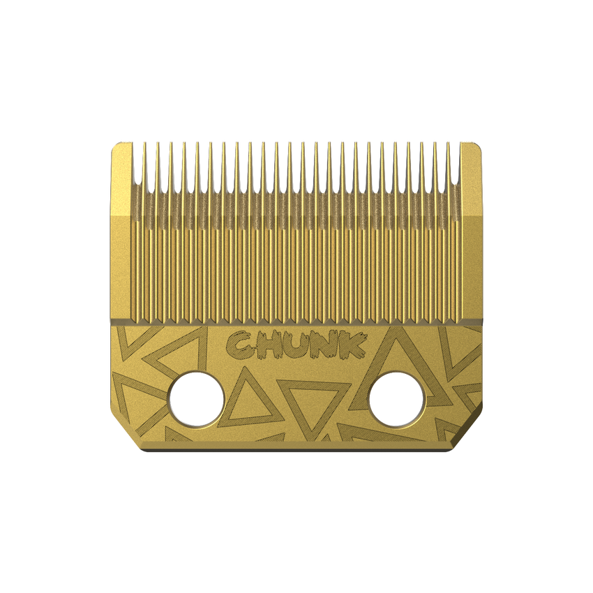 Gold hair clipper blade with geometric design on a white background