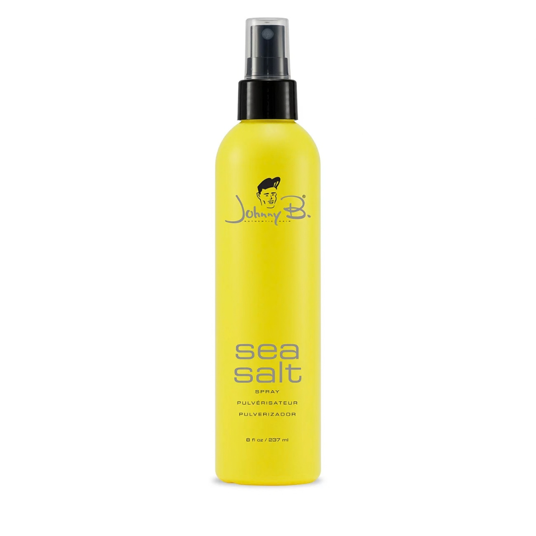 Yellow bottle that reads Johnny B Sea Salt spray with a black pump sprayer and clear pump lid on a white background